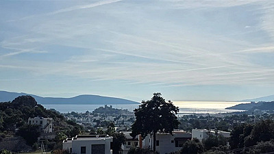 Bodrum Türkkuyusu'nda Kapanmaz Kale ve Deniz Manzaralı Satılık 5+1 Triplex Villa